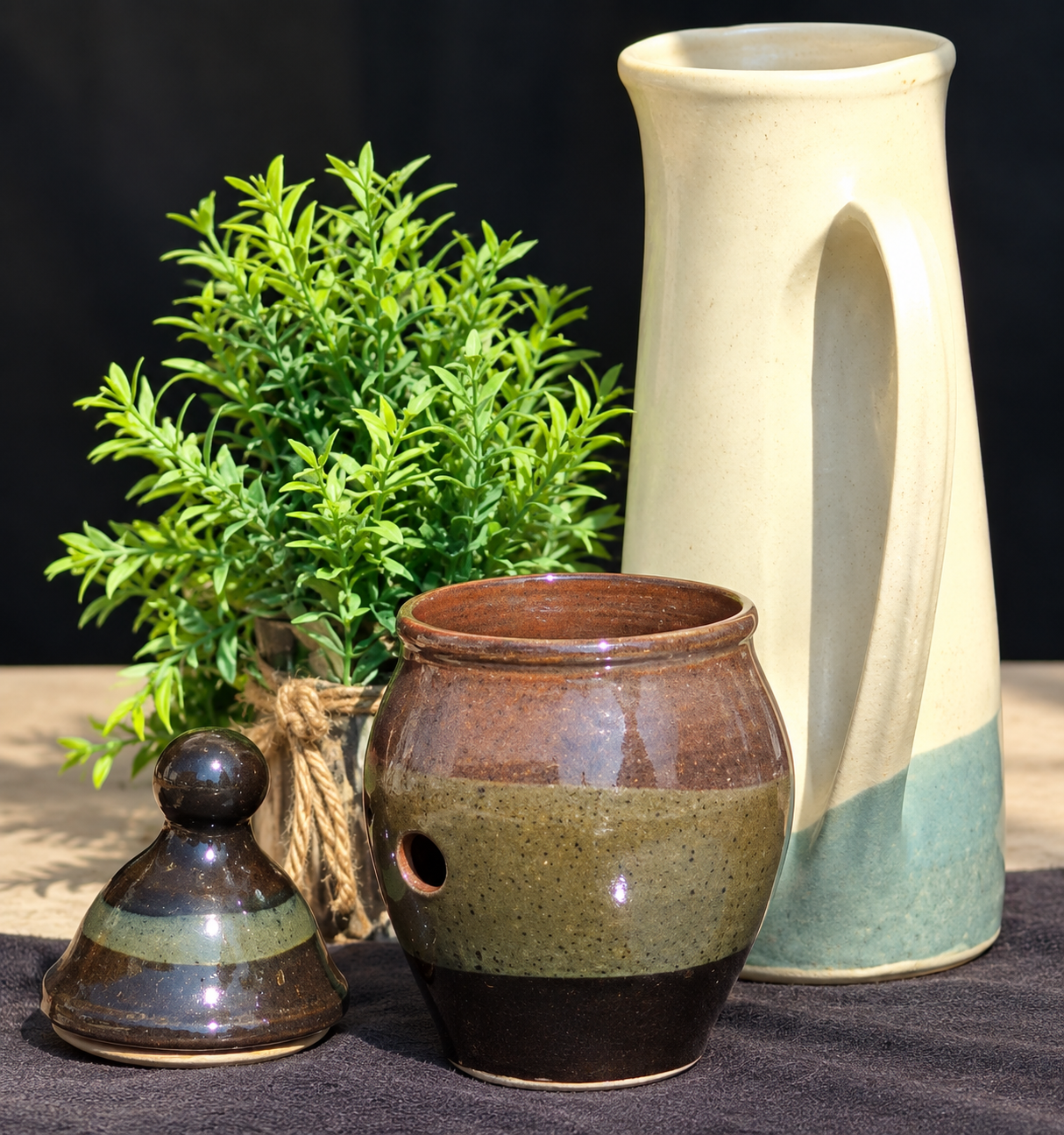 Black and earth-tone ceramic garlic keeper